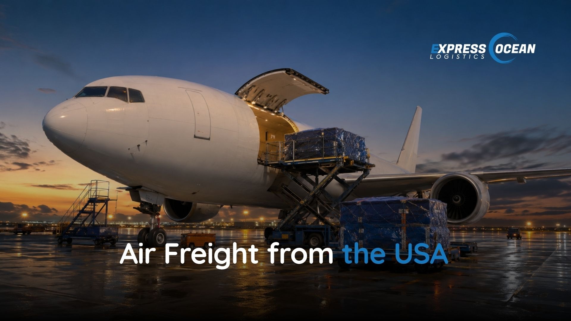 A cargo freighter aircraft being loaded with air freight pallets on the apron at a US airport
